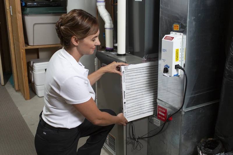Homeowner maintaining AC unit